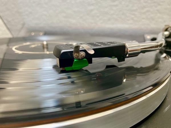 A tone arm on a record.