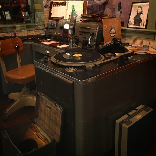 An exhibit of a radio DJ booth from the 50s.